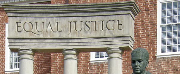 EQUAL JUSTICE carved in stone above courthouse columns